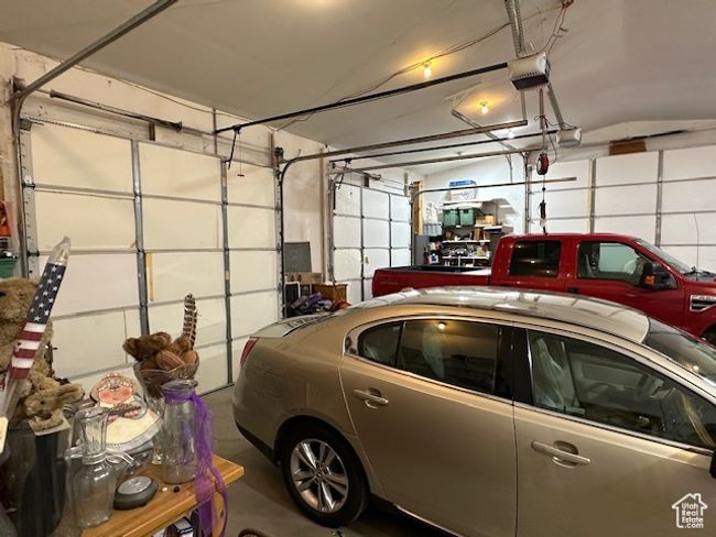 Garage with a garage door opener | Image 18