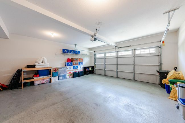 Garage featuring a garage door opener | Image 30