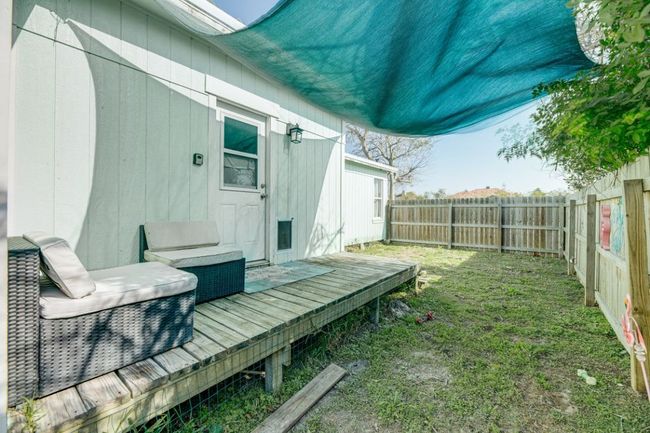 View of yard with a fenced backyard and a deck | Image 27