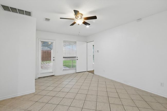 Spare room featuring a ceiling fan and baseboards | Image 11