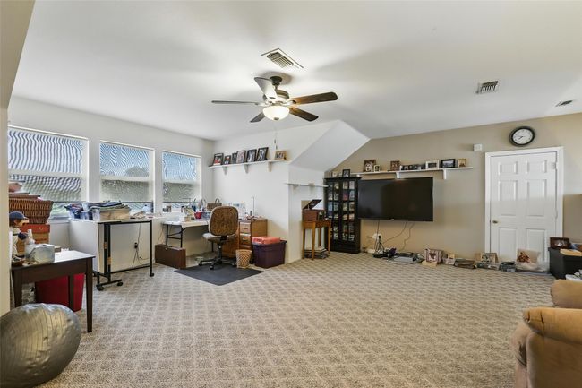 Upstairs Carpeted office with ceiling fan | Image 28