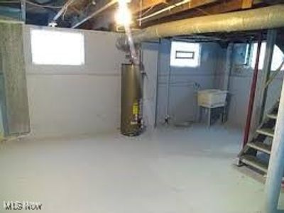 Basement featuring water heater | Image 3