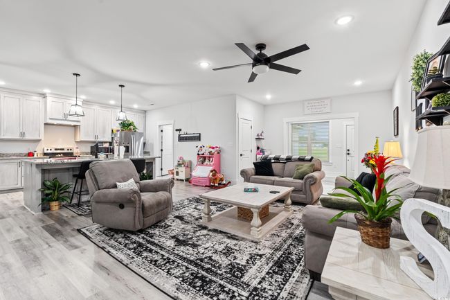 Living room featuring recessed lighting, light wood-style floors, and ceiling fan | Image 6
