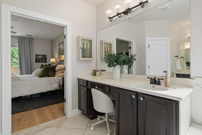 Ensuite bathroom featuring vanity, tile patterned flooring, ensuite bath, and visible vents | Image 25