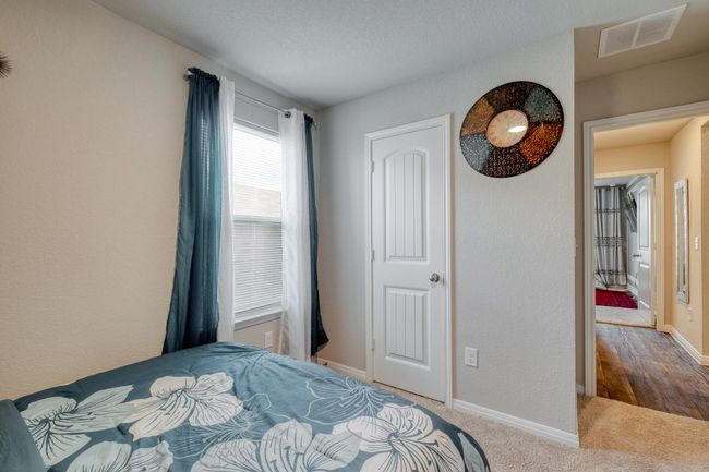 Carpeted bedroom featuring baseboards | Image 24