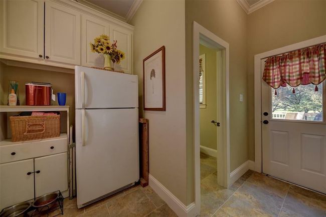 Mud room with door to the pool. There are washer dryer connections here as well. | Image 31