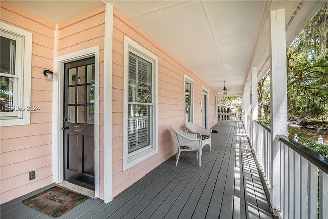 Wooden terrace featuring covered porch | Image 5