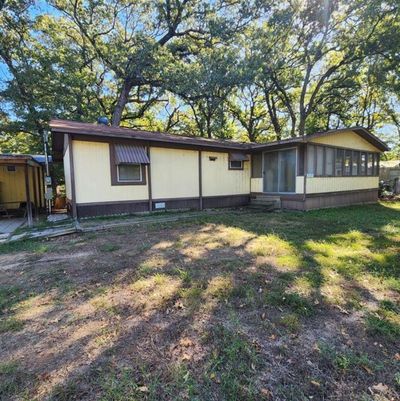 Rear view of property with a yard | Image 1