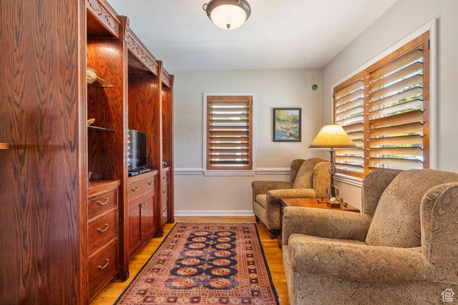 Sitting room featuring light wood-style flooring | Image 11