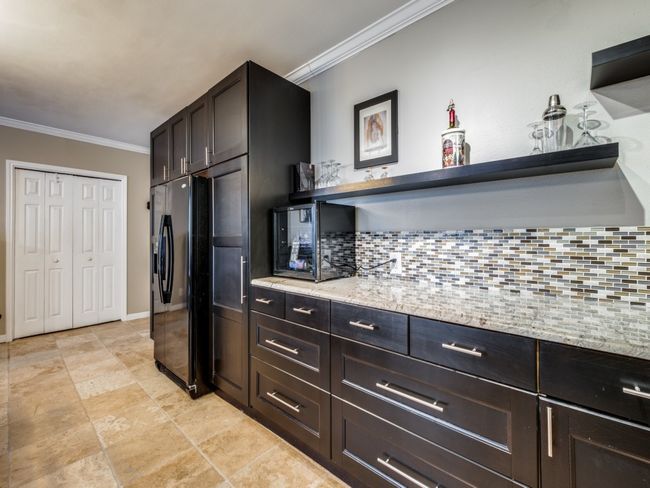 Full Bath #3, off the main hall, includes medicine cabinet, frosted glass storage unit, pedestal sink, tub, shower and commode. | Image 13