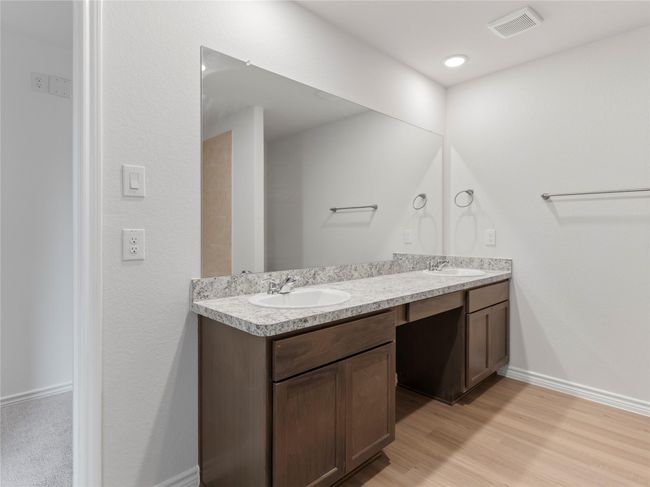 Luxurious master bath featuring a sleek double vanity. | Image 18