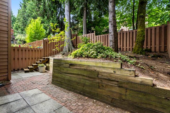 Fenced backyard featuring a patio area | Image 33