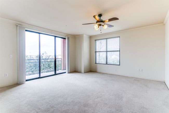 Expansive primary bedroom with outstanding views and loads of natural light. | Image 6
