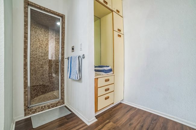 Primary bathroom with walk-in shower and plenty of cabinet space | Image 14