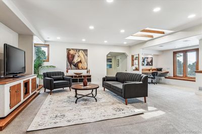 Spacious open floor plan with an adjacent home office or library. | Image 2