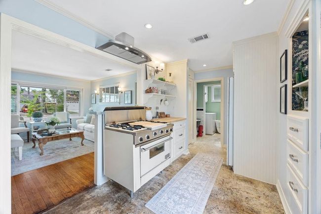 This home offers a surprising amount of storage, including deep drawers for pots and pans and two pantries. | Image 11