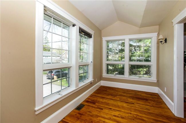 Sunroom/office with large windows, the perfect spot to work from home. | Image 11