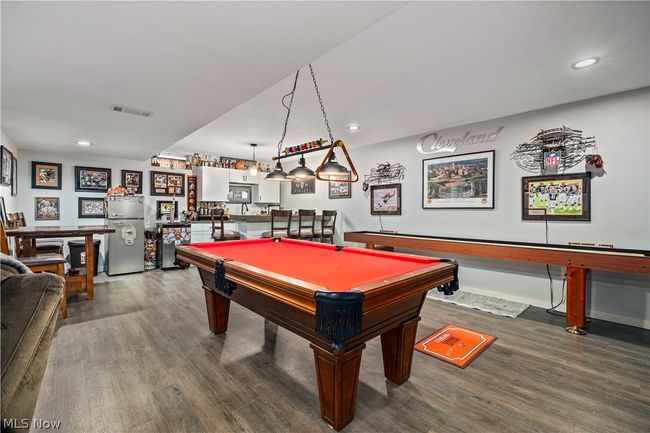 Game room featuring dark hardwood / wood-style flooring and pool table | Image 36
