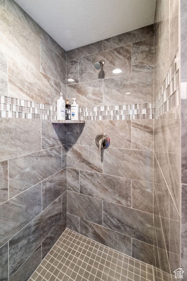 Bathroom with a tile shower | Image 20