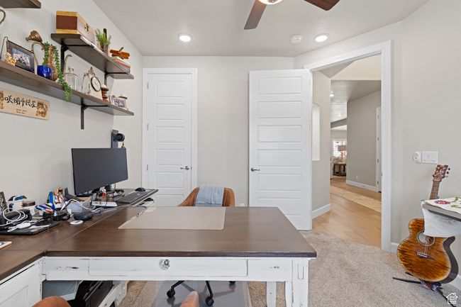 Home office with ceiling fan, light carpet, and recessed lighting | Image 56