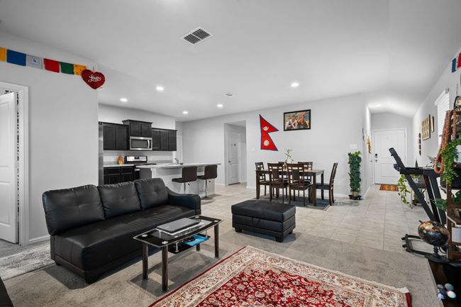 Living room with baseboards, visible vents, recessed lighting, and light tile patterned floors | Image 13