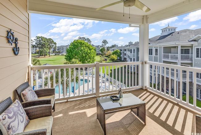 Balcony with a residential view and a ceiling fan | Image 23