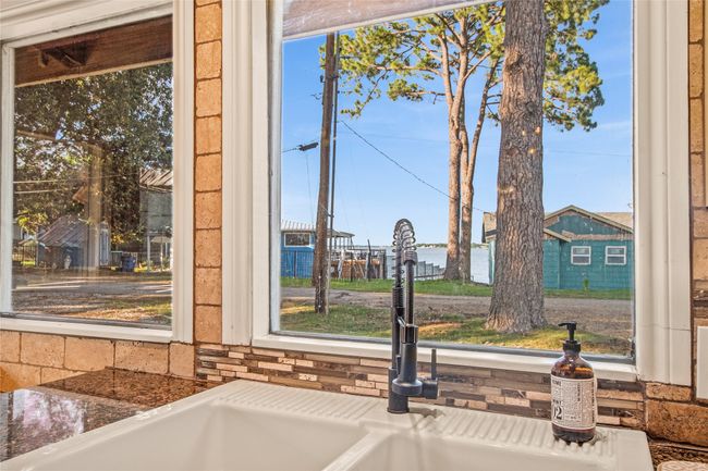 Big windows in kitchen showcase water view from front of home | Image 5