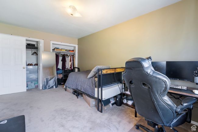 Bedroom featuring a closet and carpet flooring | Image 16