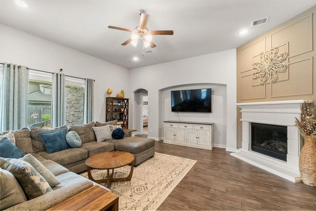 Large living room features picturesque backyard views. | Image 9