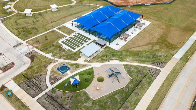 A closer overhead look at the brand-new recreational complex, featuring shaded gathering spaces, a playground, and plenty of open green areas. | Image 24