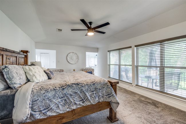 Bedroom with carpet and a ceiling fan | Image 10