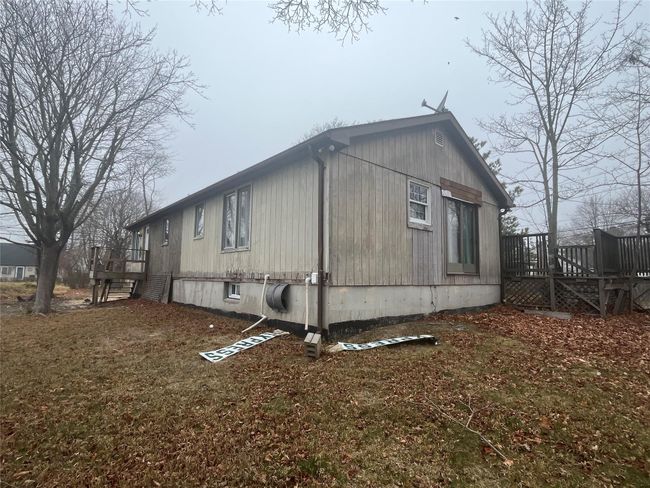View of property exterior featuring a deck and stairway | Image 10
