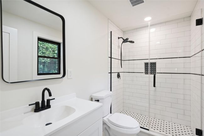 Full bathroom featuring a stall shower, vanity, and recessed lighting | Image 31