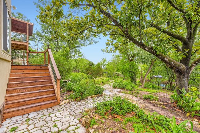 Stairs leading sown from deck to yard | Image 22