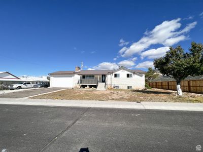 View of front of house with a garage | Image 2