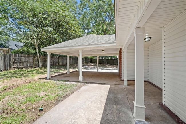 Fenced backyard featuring a patio area | Image 26