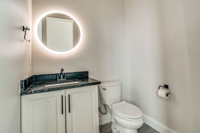 Bathroom featuring vanity and toilet | Image 10