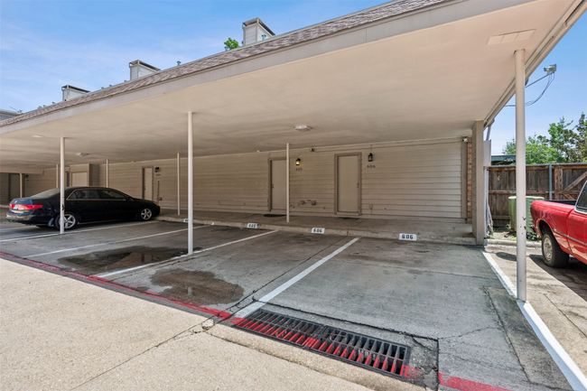 Covered parking lot featuring fence | Image 21