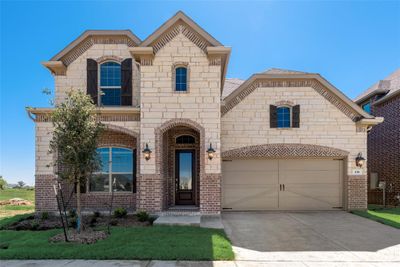 View of front of property with a garage | Image 1