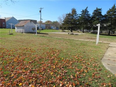 View of yard featuring a storage unit | Image 3