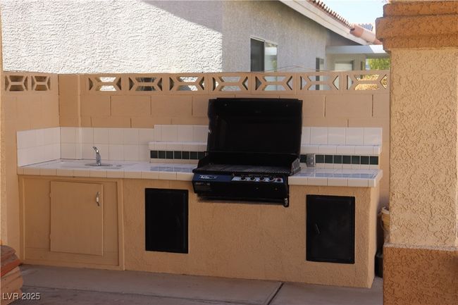 View of patio / terrace with exterior kitchen and a sink | Image 65