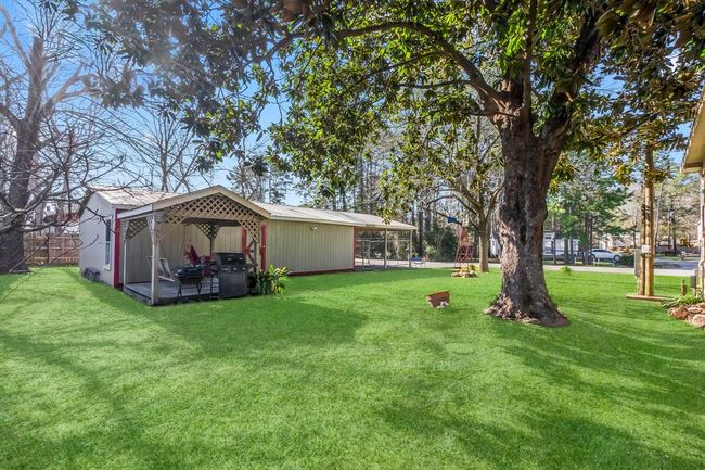 Standing in the back yard looking towards the detached workshop/garage/carport | Image 39