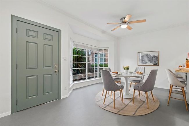 Dining area tucked next to Bay Windows overlooking courtyard | Image 7