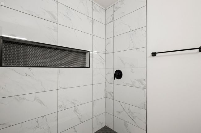 Full bath featuring a tile shower | Image 19