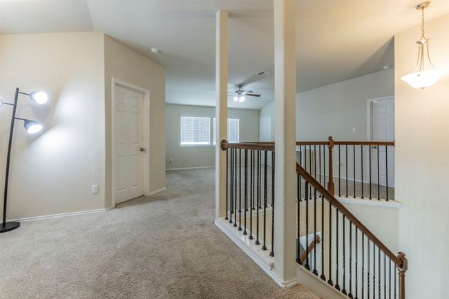 Hall featuring baseboards, carpet, and an upstairs landing | Image 20