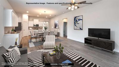 Living room featuring light wood-type flooring and ceiling fan with notable chandelier | Image 3