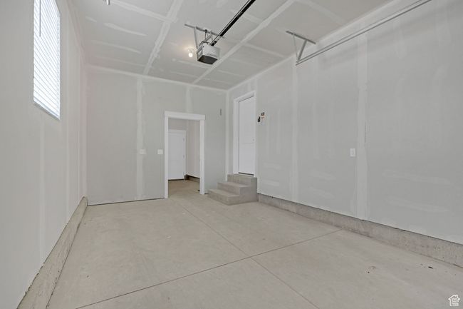 Garage with a garage door opener | Image 18