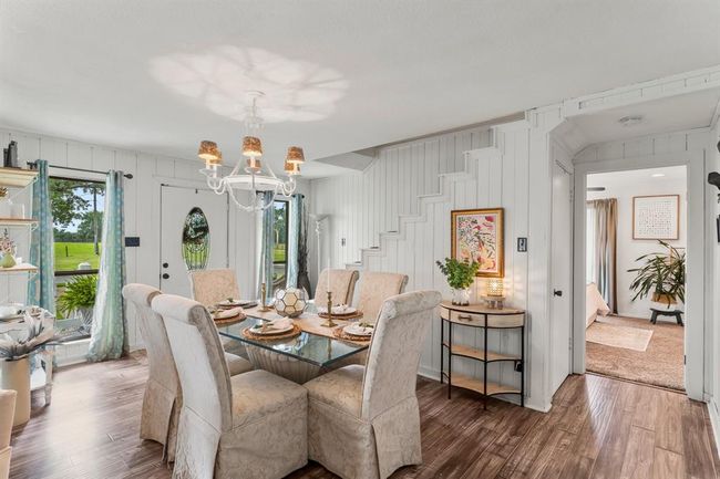 Beautiful modern farmhouse design! Door opening to the right leads to the primary suite. | Image 9