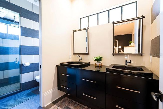 The attached bath includes double sinks, ample drawer storage and a full w | Image 36