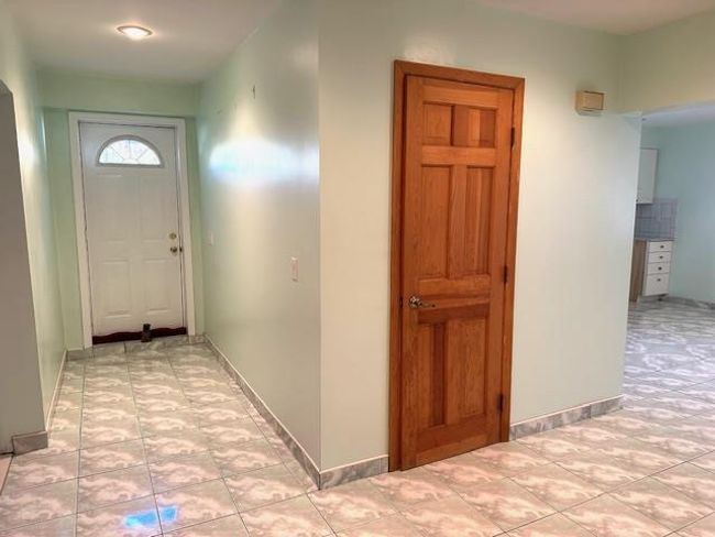 Hallway with light tile patterned floors | Image 23